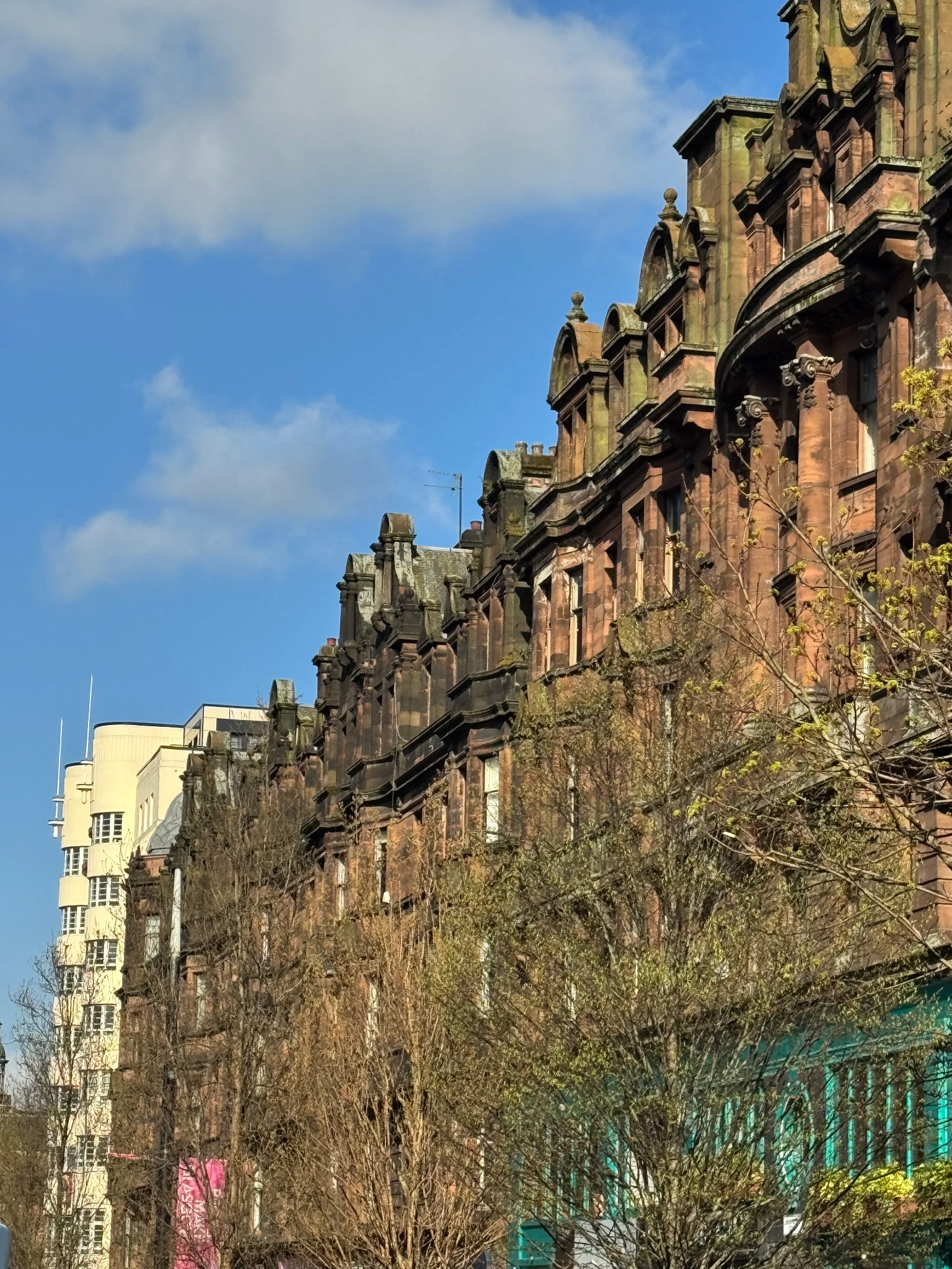 Historic urban architecture rising beside a bright blue sky